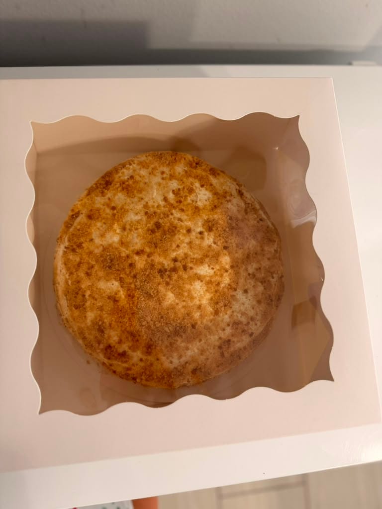 Top-down view of Medovik in its gift-ready bakery box