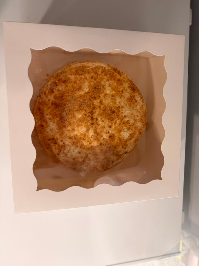 Russian Medovik cake packaged in a windowed bakery box