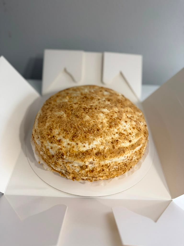 Side view of Medovik showing thin honey layers and cream filling